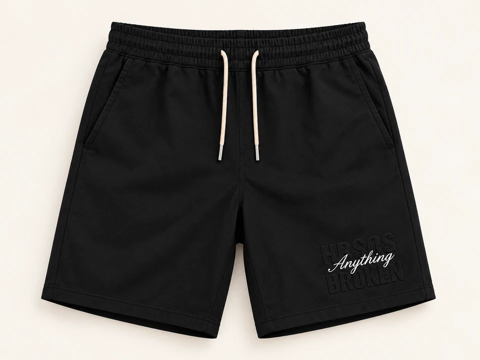 Black Embossed Lettering Sweat Shorts on a warm studio background