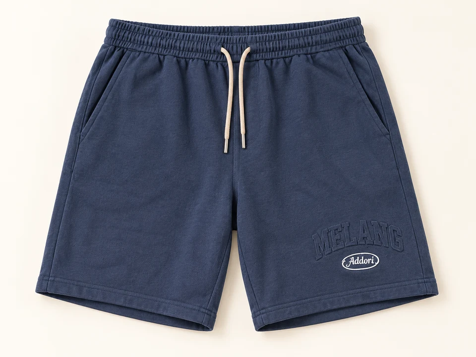 Slate Blue Melang Sweat Shorts on a warm studio background
