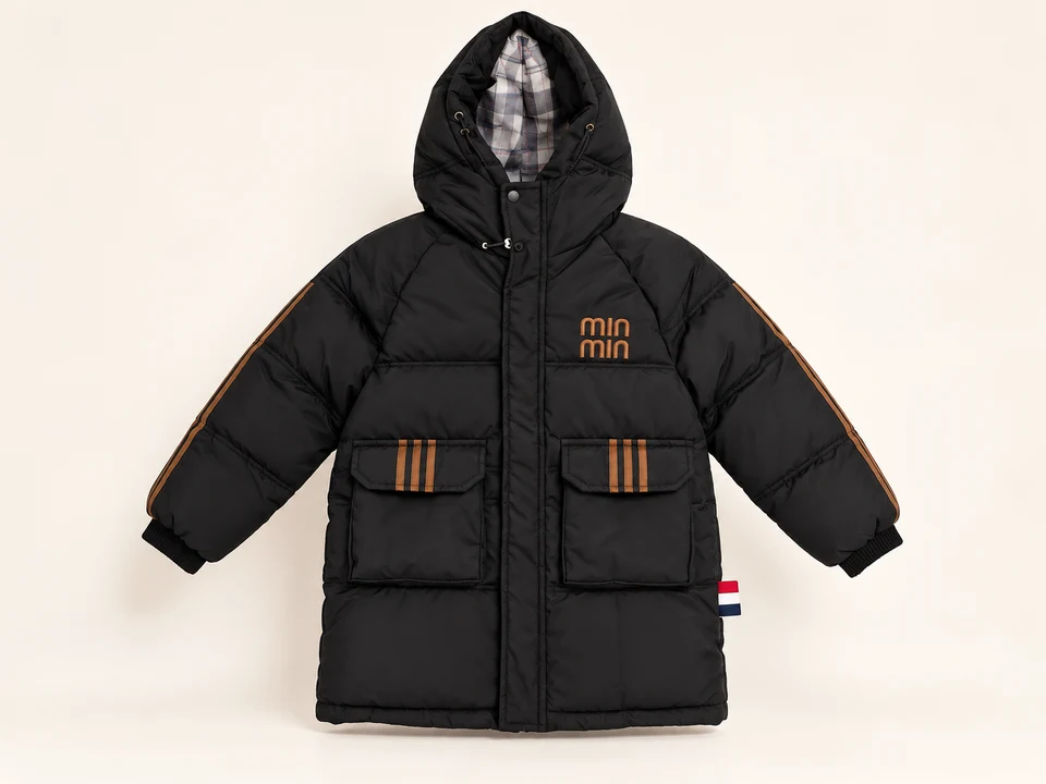 Black Padded Coat with Tan Details on a warm studio background