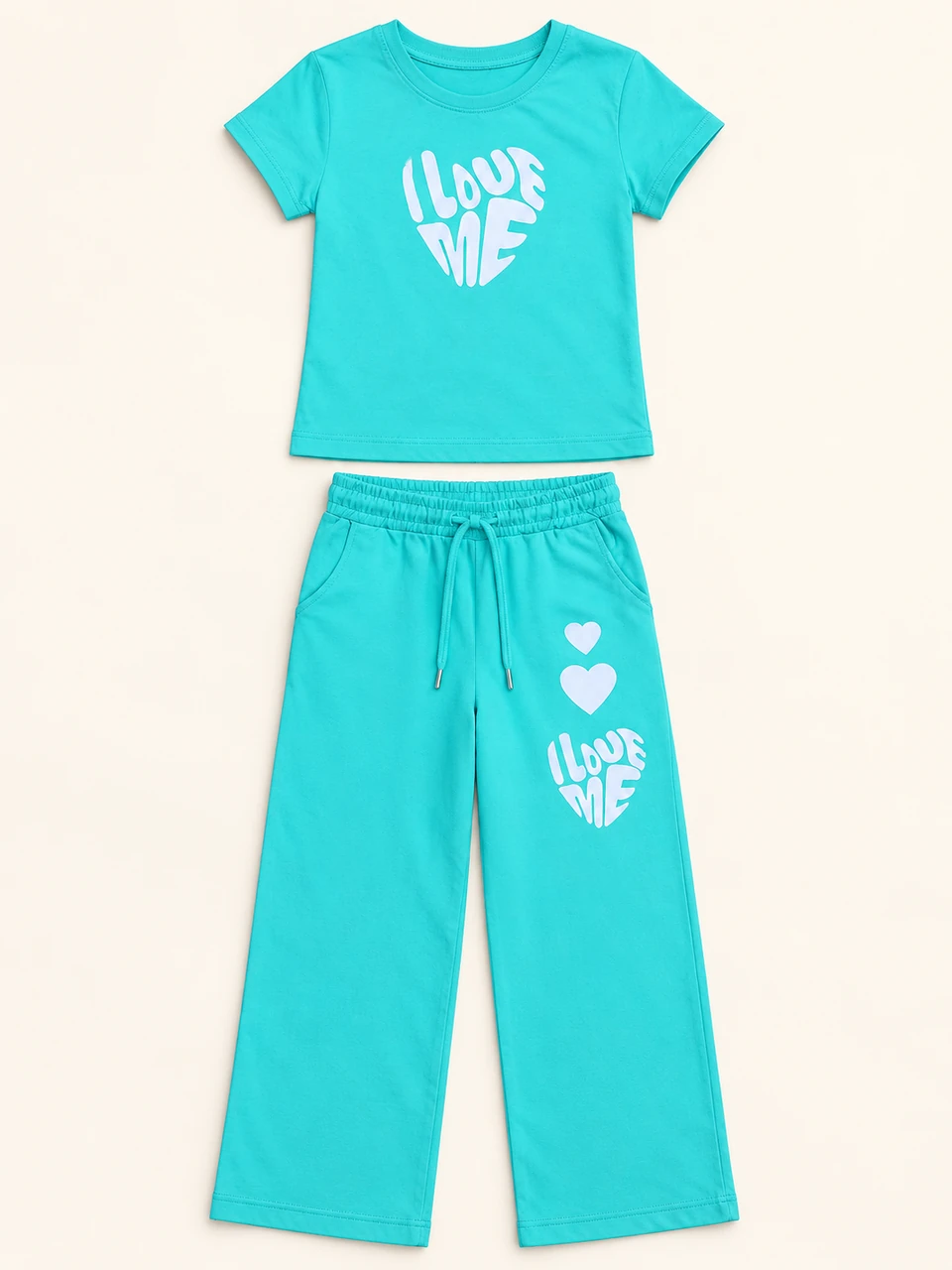Turquoise Love Me T-shirt and Trouser Set on a warm studio background