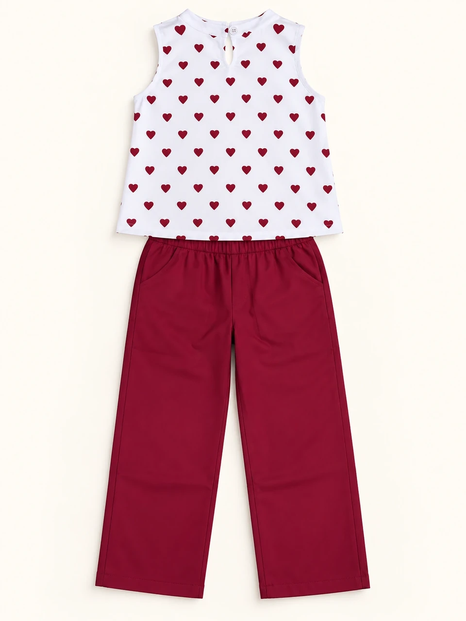 Burgundy Heart Top and Trouser Set on a warm studio background