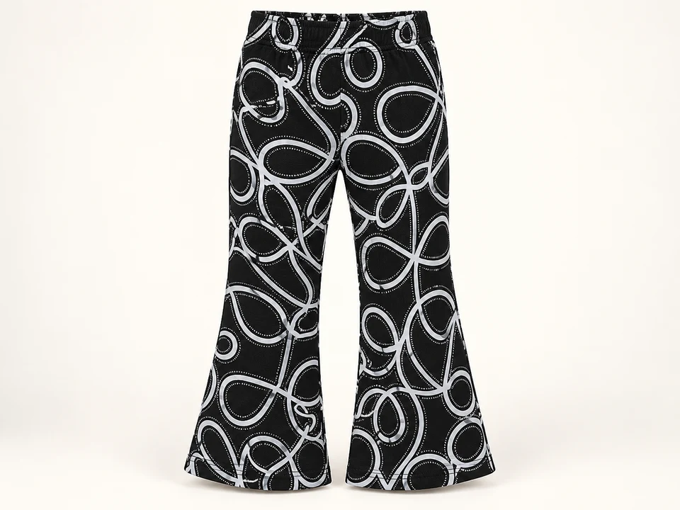 Black and White Loop Print Trousers on a warm studio background