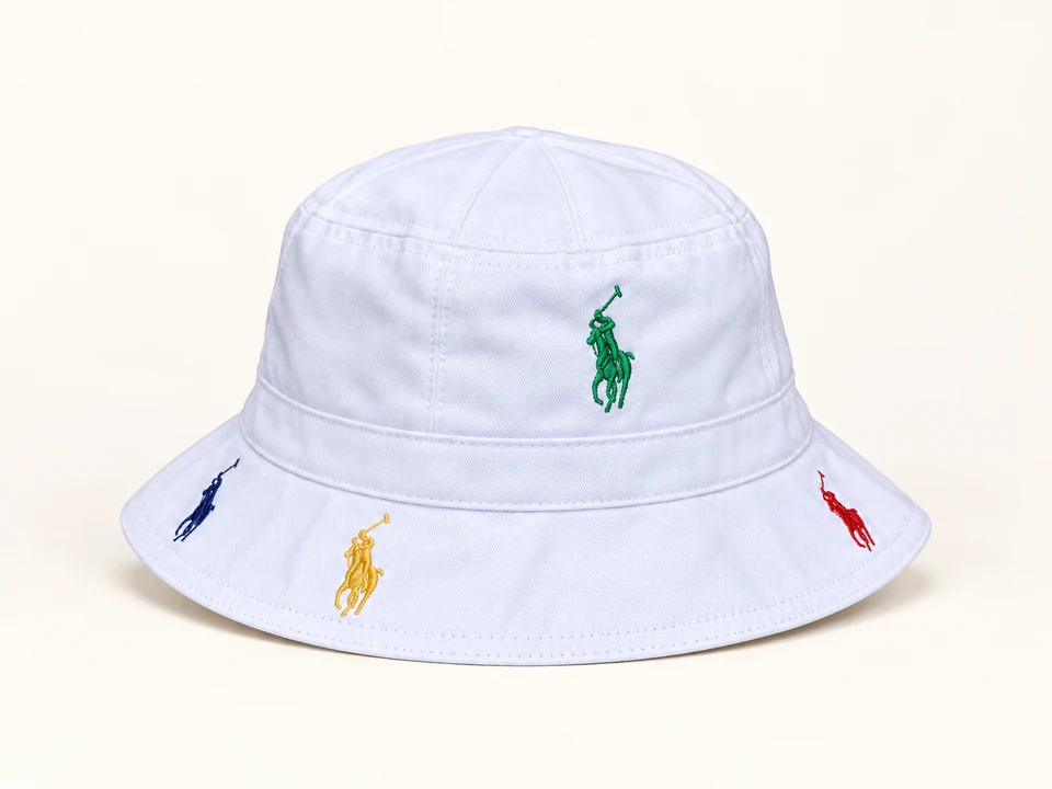 White Multicolour Embroidered Bucket Hat on a warm studio background