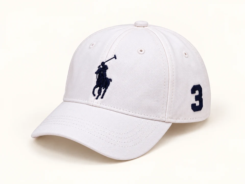 Cream Embroidered Number 3 Cap on a warm studio background